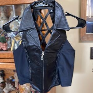 Black leather vest with open back. Worn once in perfect condition. Size medium